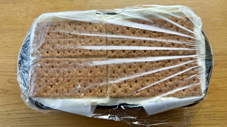 graham crackers in loaf pan wrapped in plastic