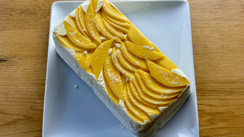 whipped cream graham cracker icebox cake with mango topping