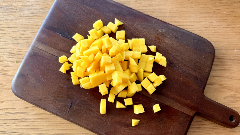 diced mango on a wooden board