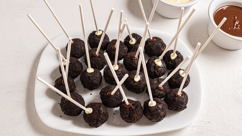 brownie pops on white plate