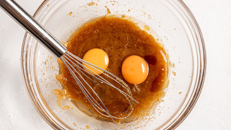 eggs floating on brown liquid