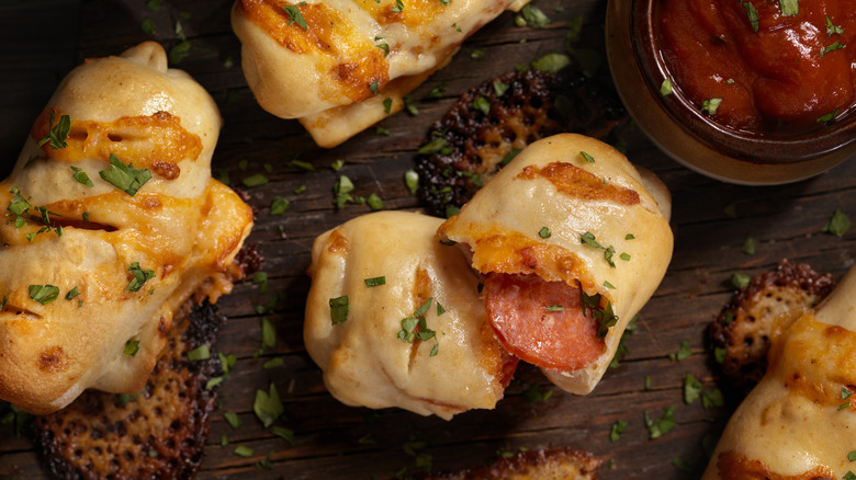 Pizza roll on wooden board