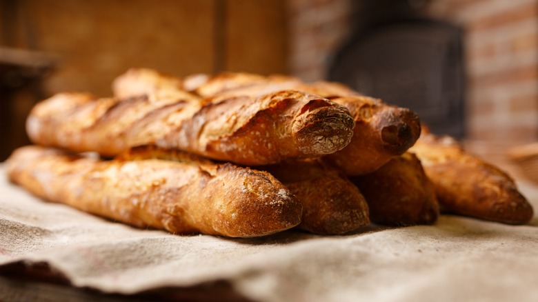 Pile of French baguettes with golden-brown crusts