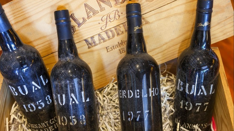 Wooden box with Madeira wine bottles