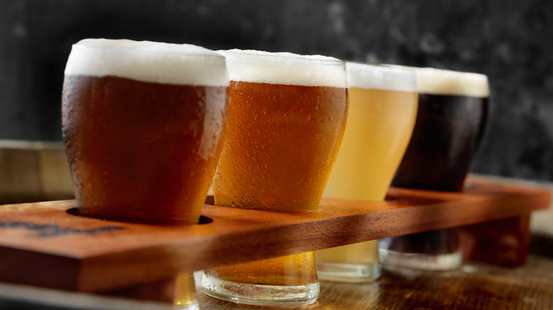 A flight of beers in various colors