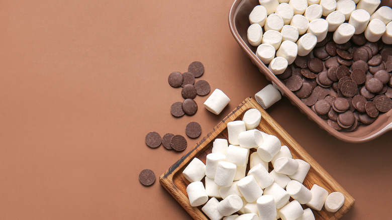 Chocolate and marshmallows on brown table