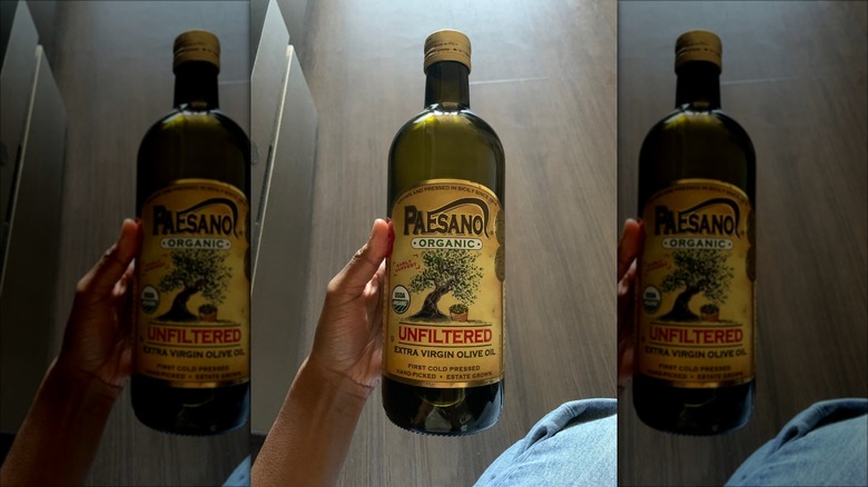 Person holding Paesano Olive Oil