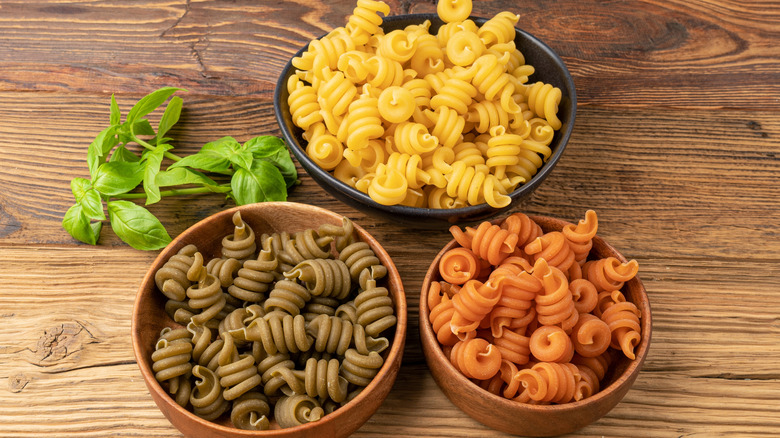 Different types of dried vesuvio pasta in bowls