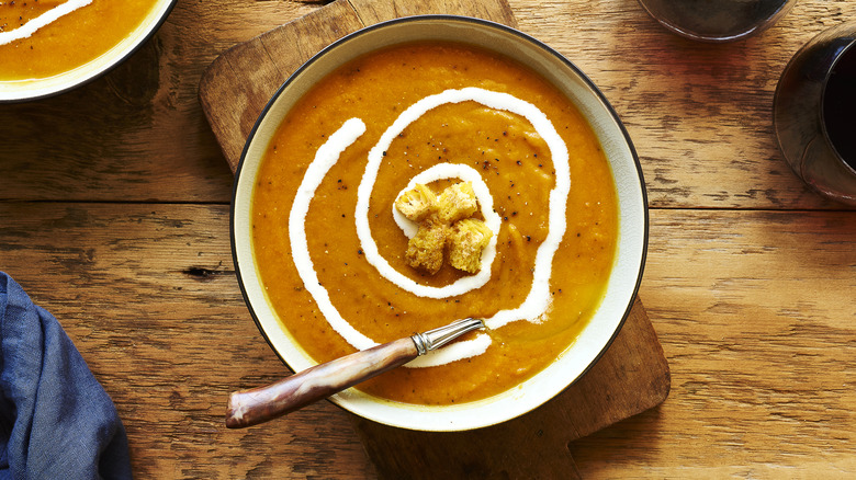 Top down of butternut squash soup with croutons