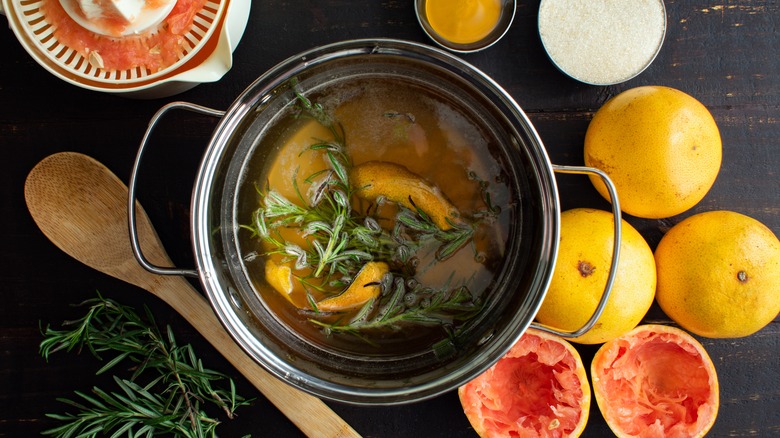 Pot with ingredients for rosemary simple syrup