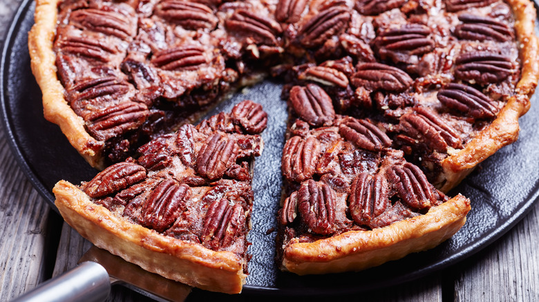 Sliced chocolate pecan pie