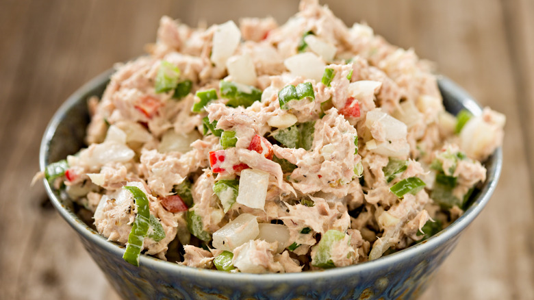 A big bowl of tuna salad with bright mix-ins like celery and red bell pepper.