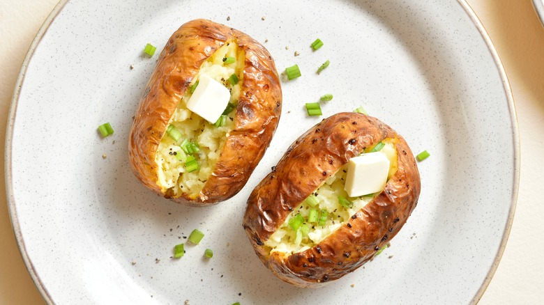 Baked potatoes on white plate