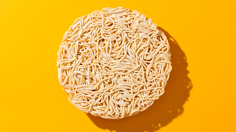 Ramen noodles on a yellow background