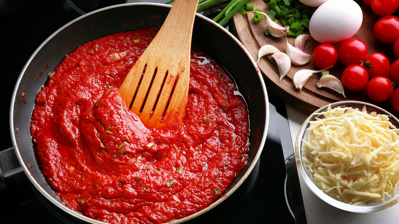 cooking tomato sauce in skillet