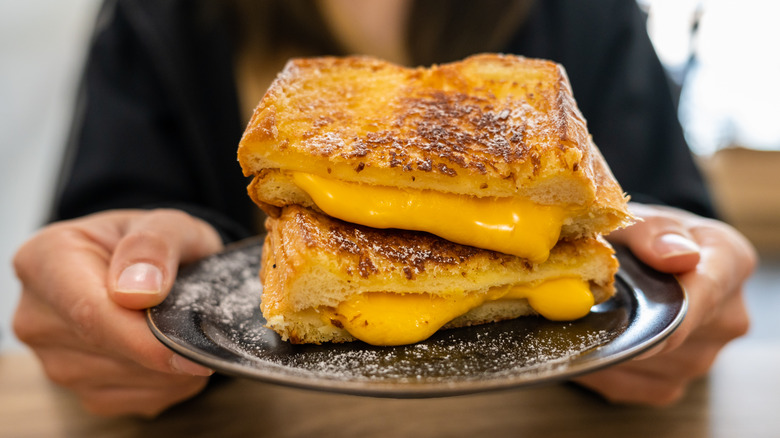 cut grilled cheese on plate