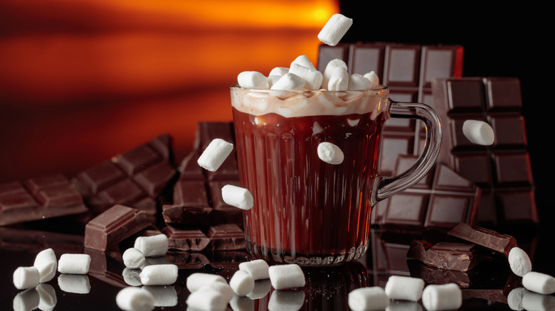 Mug of brown liquid with marshmallows