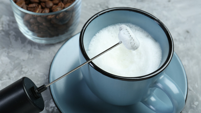 Milk has been frothed with a handheld milk frother