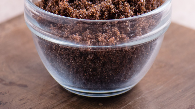 glass bowl filled with dark brown sugar