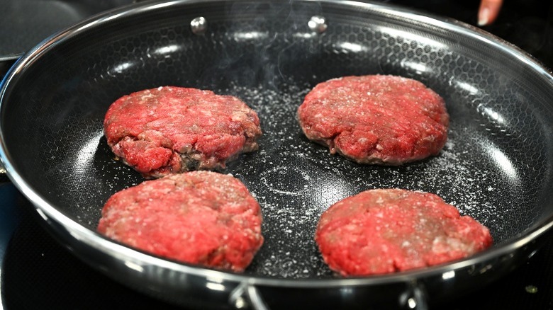 Burgers cooking in HexClad pan