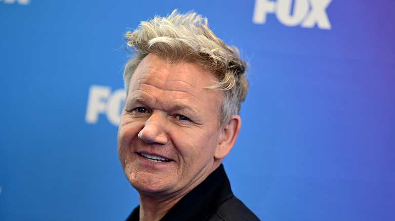 Gordon Ramsay's head on a blue-white background.