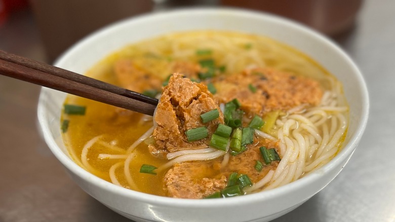 A bowl of bun rieu crab noodle soup. 