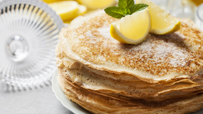 English pancakes with lemon wedges and sugar