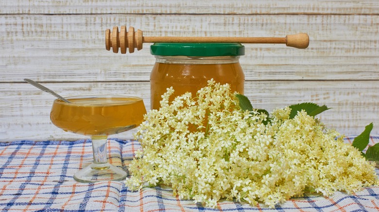 Honey jar and elderflower