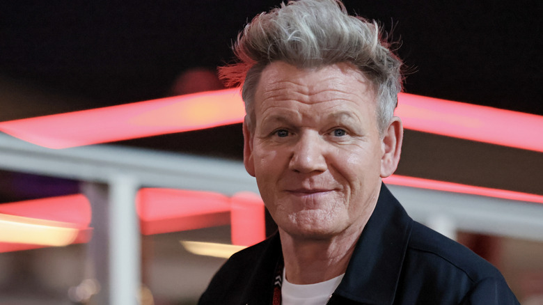 Gordon Ramsay smiling in the foreground