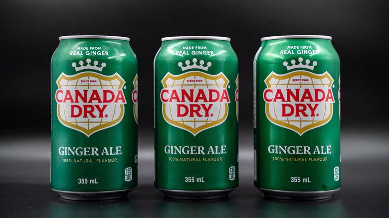 Three cans of Canada Dry ginger ale