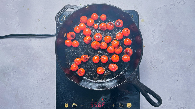 blistered tomatoes in skillet
