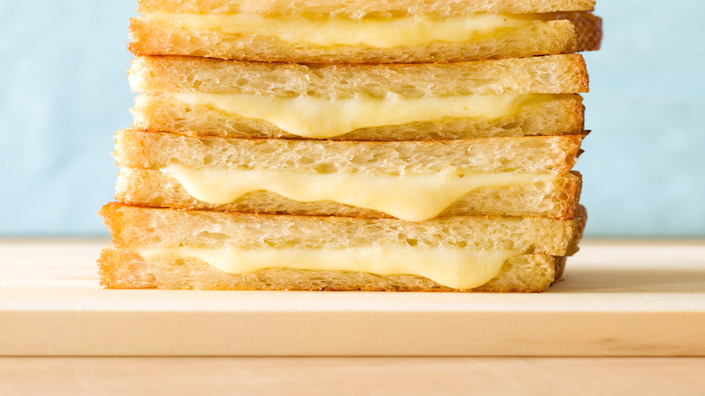 Stack of melty cheese sandwiches