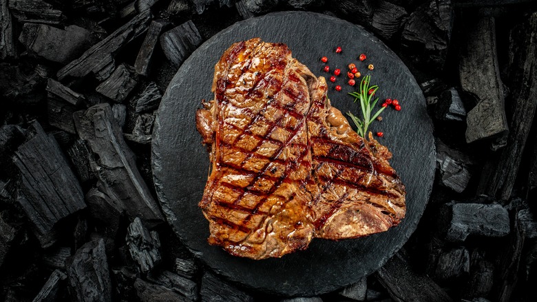 T-bone steak on coal grill