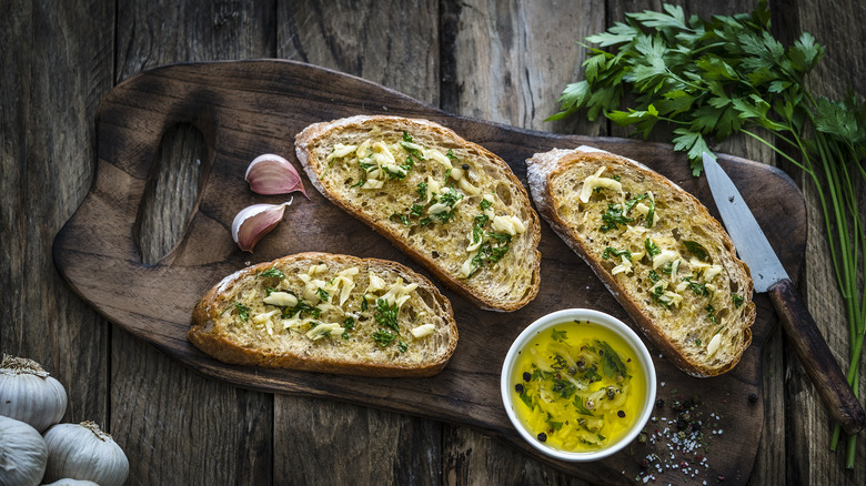 Garlic bread on a wooden board
