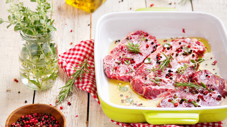 Steaks marinating with olive oil