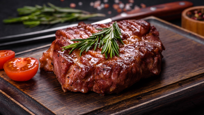 Grilled steak on cutting board