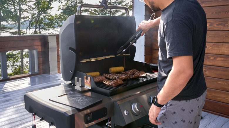 Man cooking on large grill