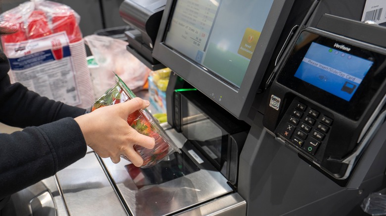 Person scanning at Costco checkout