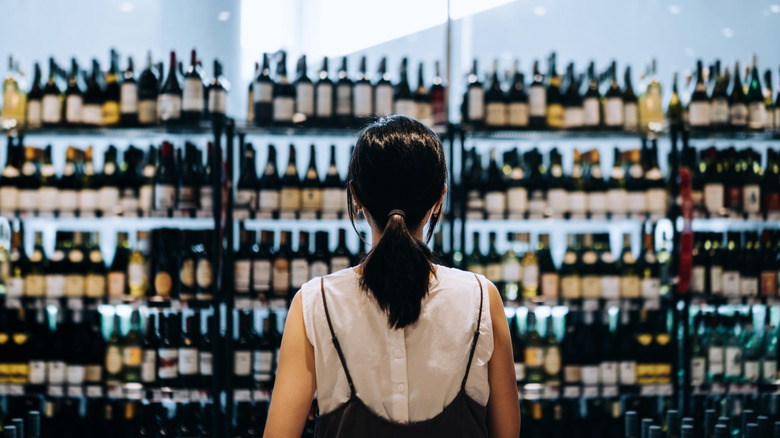 shopper looking at wine display