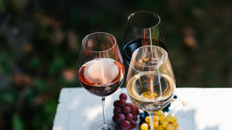 three different wines in glasses