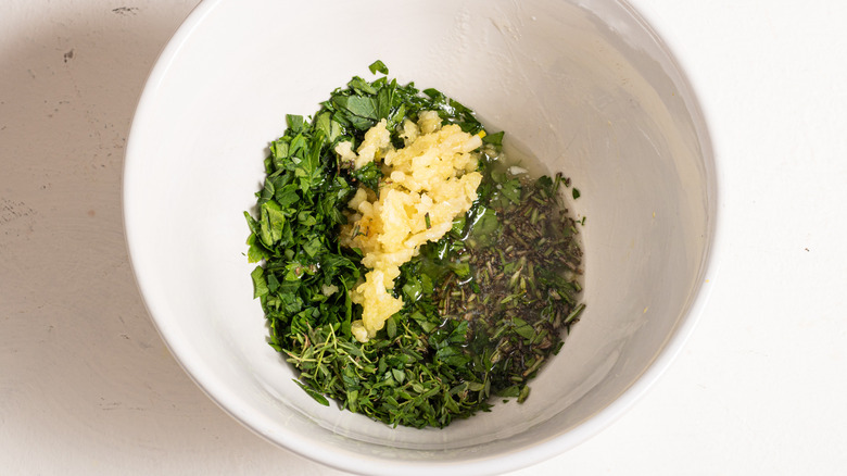 Bowl with herbs and minced garlic