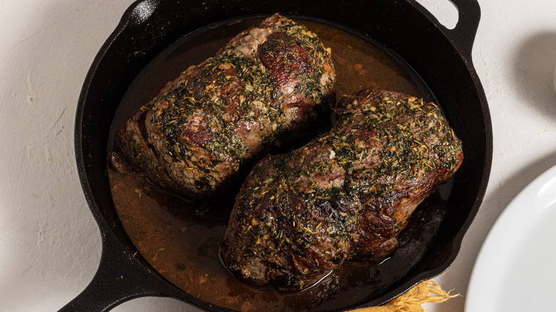 Cast iron skillet with herb-roasted beef tenderloin