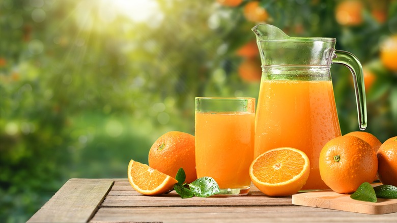 orange pitcher jug and glass outdoors