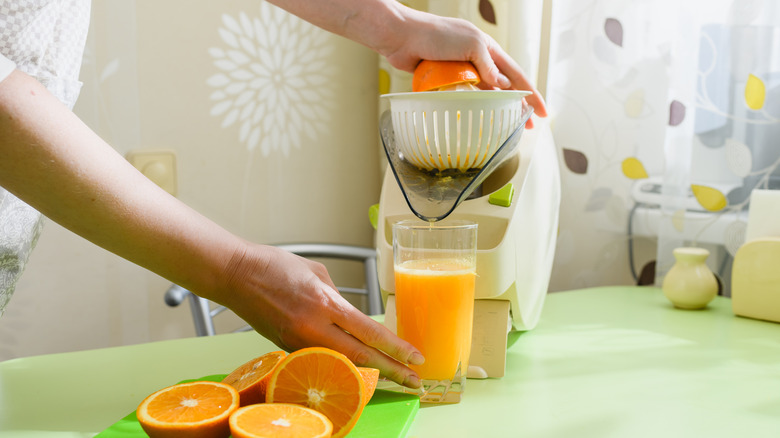 Person making orange juice