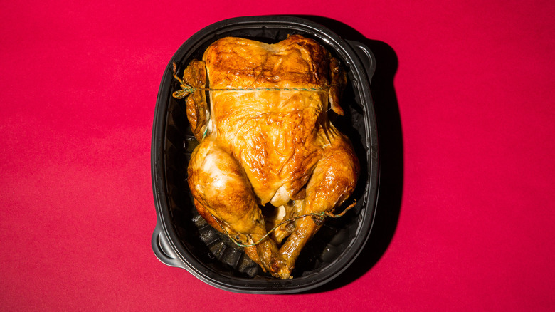 Rotisserie chicken in plastic container