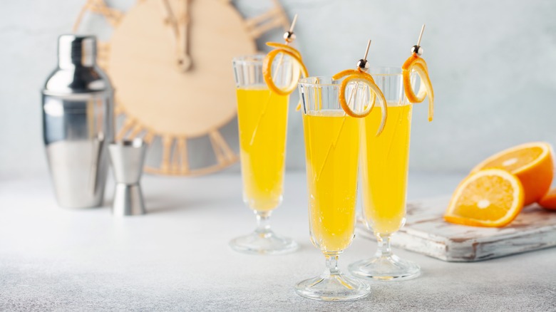 Mimosas with orange peel garnish