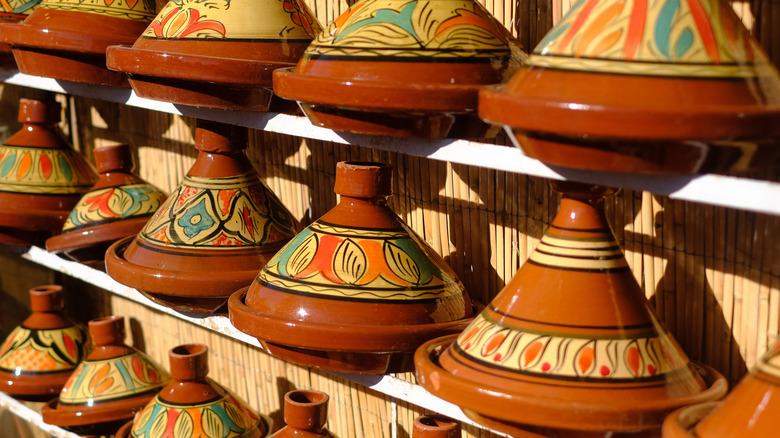 Tagines lined up on a shelf in Morocco