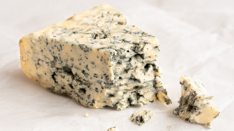 Crumbled wedge of blue cheese