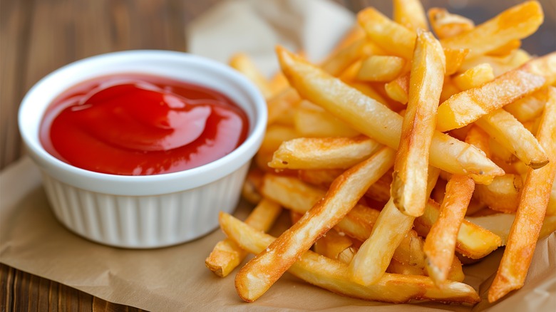 French fries and cup of ketchup