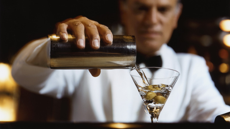 Bartender pouring a martini